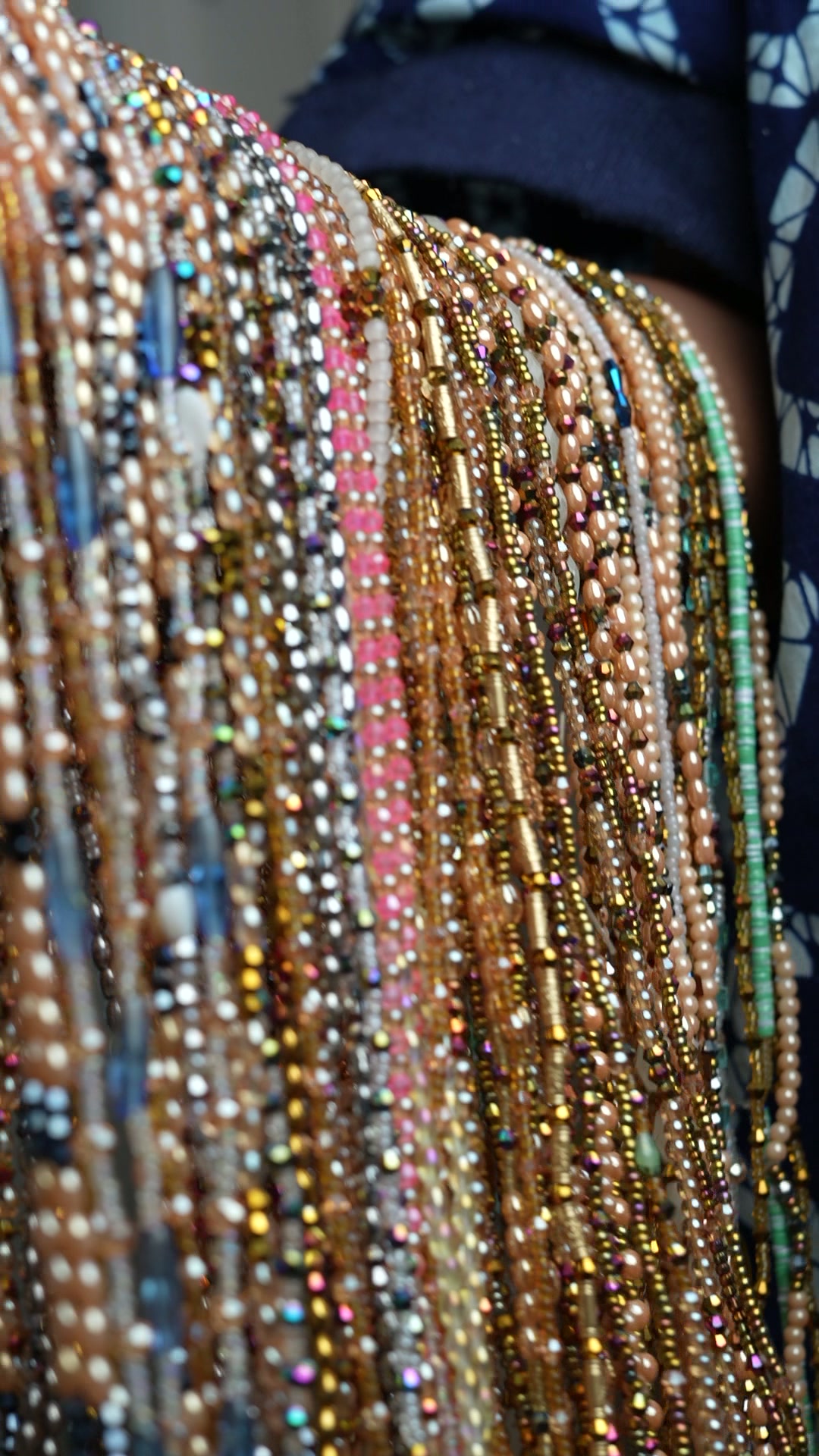 CASABEADS — luxury Nigerian glass beads cascading in champagne, gold, and pearl tones